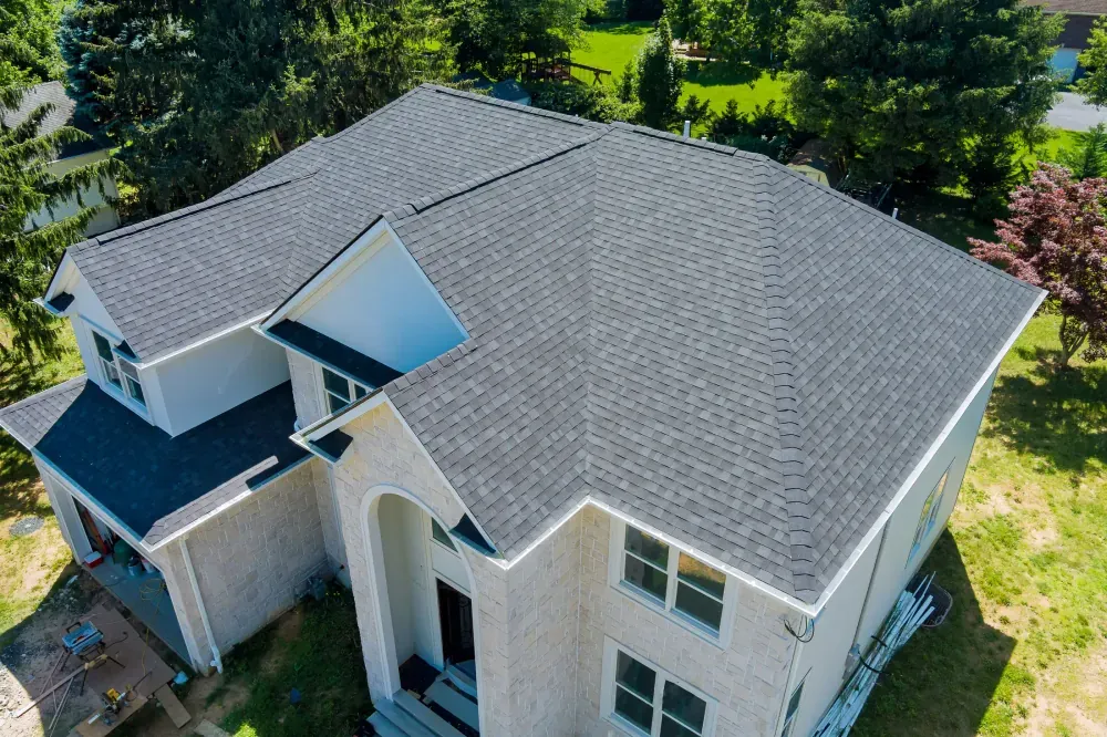Aerial view of a new asphalt shingle roof on a home