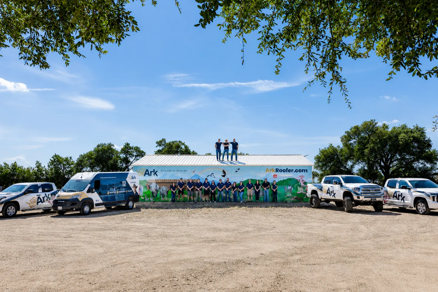 The Ark Roofer team and fleet outside the Georgetown headquarters