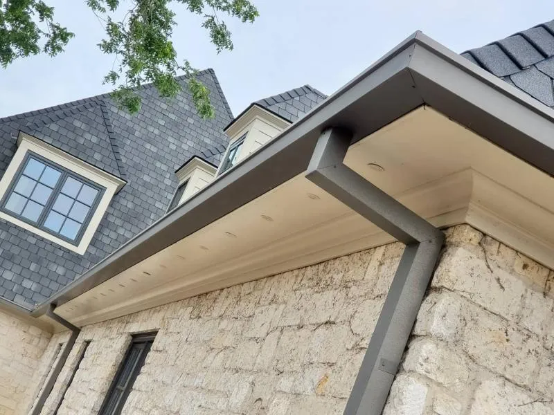Box gutter installed on a stone Leander home