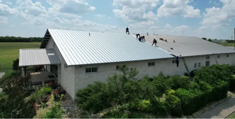 Ark crew replacing a commercial metal roof system in Austin