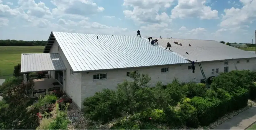Ark crew replacing a commercial metal roof system