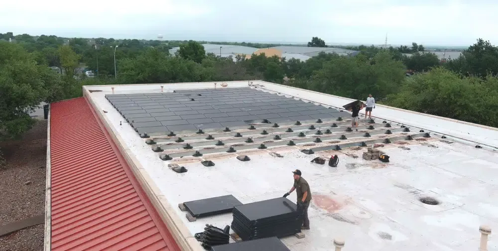 Ark crew performing technical commercial roof work in Austin