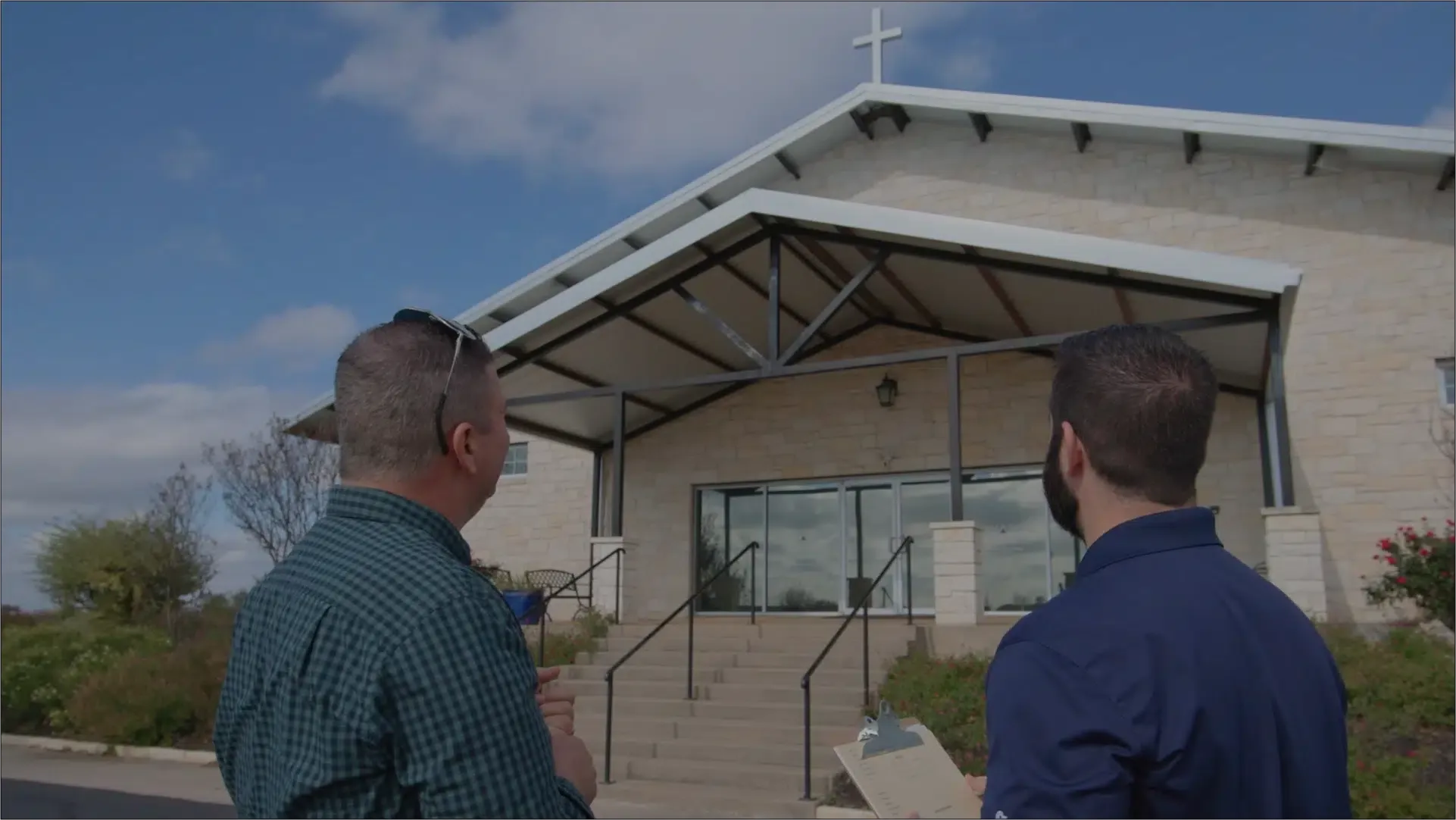 Ark consultant reviewing a commercial roof with a property owner in Austin