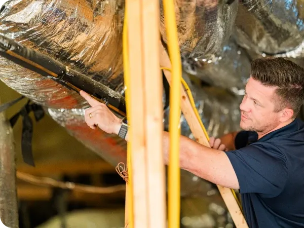 Ark technician measuring attic airflow in Austin