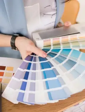 Ark consultant reviewing Sherwin-Williams color options with a homeowner