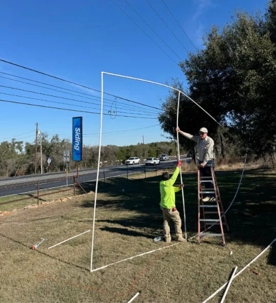 Ark crew installing signage at the Georgetown yard